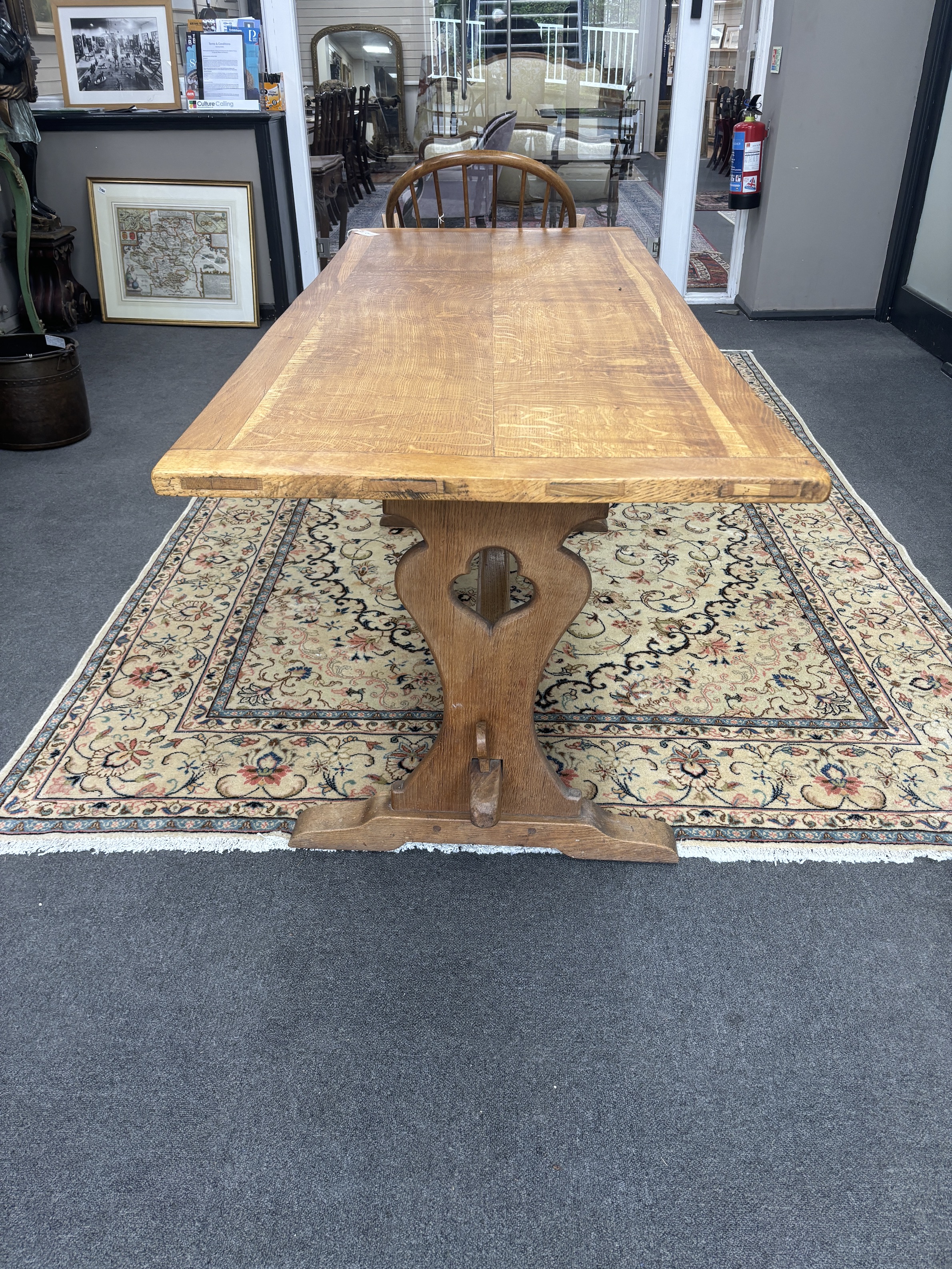 An Arts & Crafts style rectangular oak refectory dining table, width 175cm, depth 73cm, height 73cm